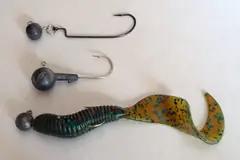 Jig heads with a curly-tail soft plastic